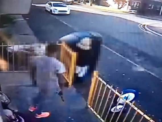 CCTV footage captured from outside the corner shop shows a man with a gun in his hand yesterday, which sparked a showdown with armed officers