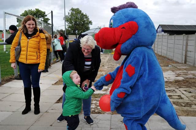 Leo Stott, two, met hotel mascot Dalmo the Dinosaur