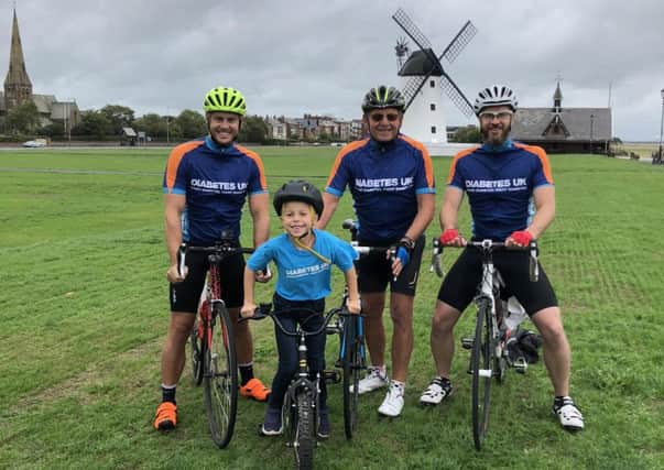 Six year old Henry Swift with dad Andrew, uncle Ian Swift and grandad Edward Cook ahead of the charity ride to Paris