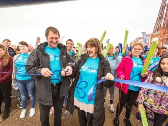 Anne Nolan, whose mother Maureen had dementia, and ex-Blackpool football player Dave Serella, who is living with dementia, cut the ribbon to open the walk (Photo: Chris Bull)