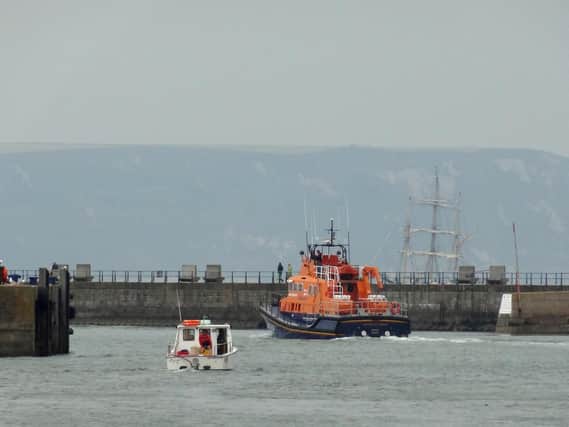 File photo of an RNLI Lifeboat in Weymouth Harbour in May 2012, taking part in the search for a fishing boat and her three crew members
