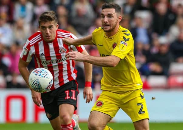 Fleetwood Town's Lewis Coyle gets away from Sunderland's Lynden Gooch