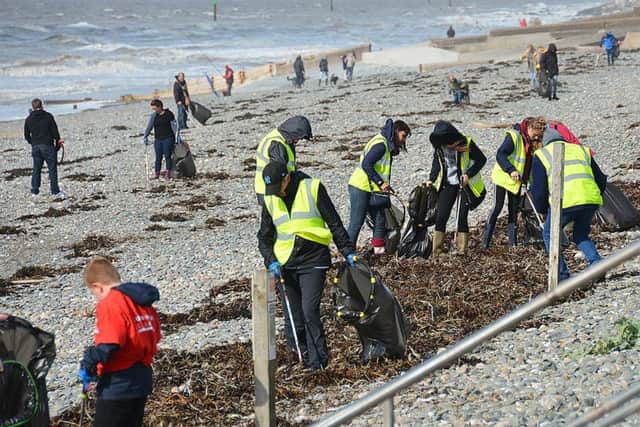 The litter pickers in action clearing Rossall beach