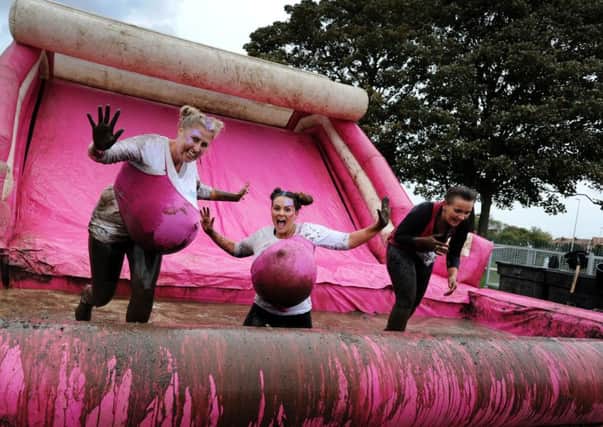 The annual Pretty Muddy 5k race for Cancer Research UK took place at Lawson's Field today. Hundreds of women and children took part in the event which involved getting very wet and extremely muddy, all in a good cause. Picture by Paul Heyes, Saturday August 22, 2018.