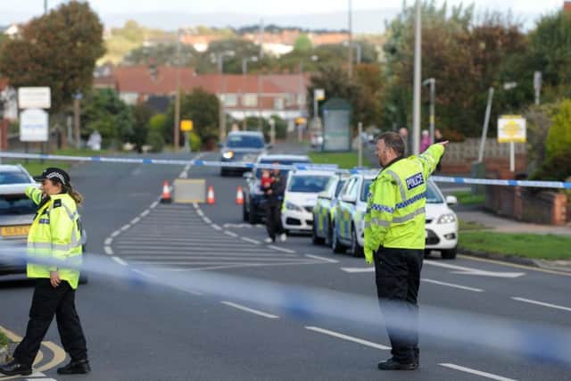 Officers at the scene of the accident yesterday