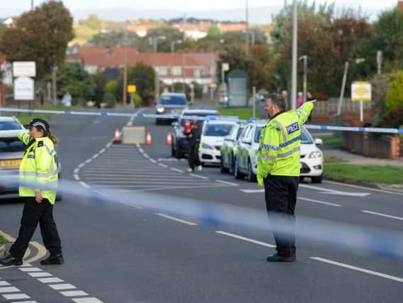 Officers at the scene of the accident yesterday
