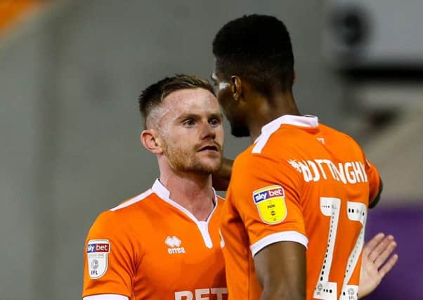 Ollie Turton and Michael Nottingham celebrate victory over QPR
