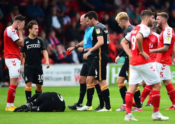Fleetwood Town's Wes Burns is sent off for a challenge on Bradford City's Adam Chicksen