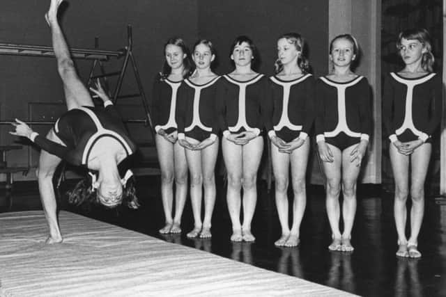 Adrienne Orr does a backward somersault, with SS Mary and Michael RC Primary School gymnastic team in 1975