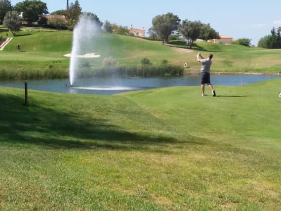 Chris Boyes takes aim over the water at the 17th at Gramacho