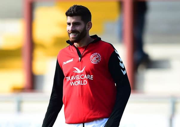 Fleetwood Town's Ched Evans warms up