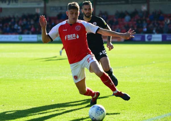 Fleetwood Town's Harrison Biggins in action
