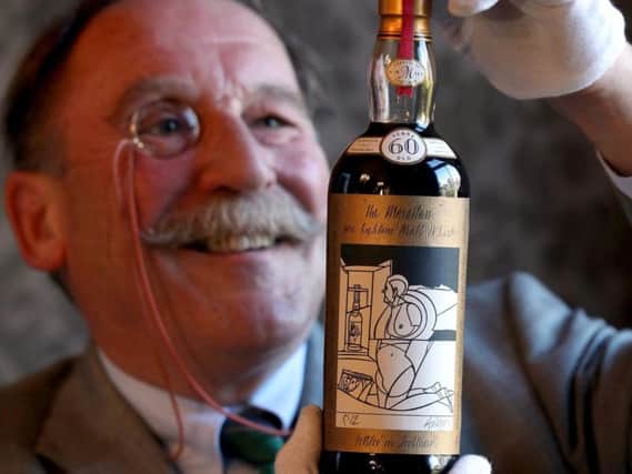 Whisky expert Charles MacLean with the world's rarest and most valuable whisky