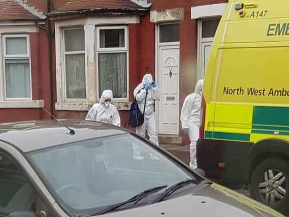 Paramedics in full body protective suits and face masks in Fleetwood