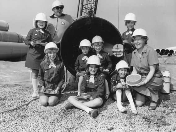Blackpool Brownies from the 18th pack brew up in a giant pipe in 1984, to mark 70 years