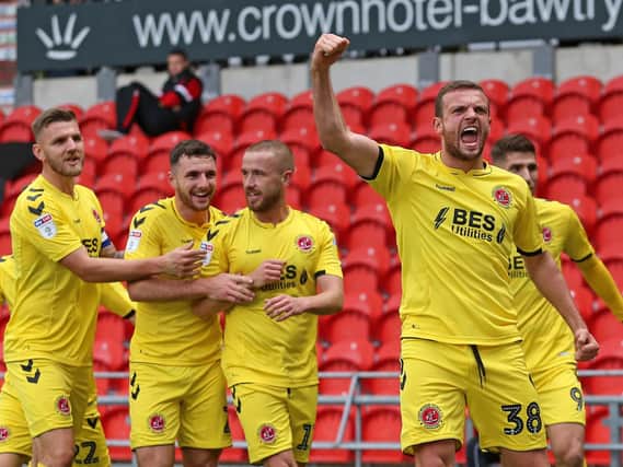 The Fleetwood Town players celebrate scoring at Doncaster