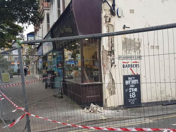 The lorry is said to have reversed into the shop while trying to negotiate a corner made tighter by parked vehicles