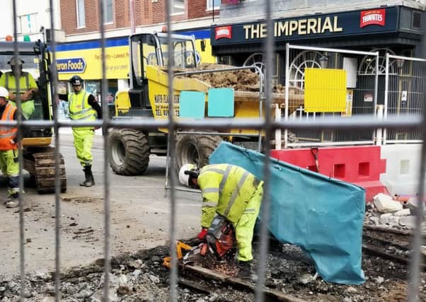 Workers are removing the old tram tracks buried beneath Talbot Road, Blackpool, to make way for new ones