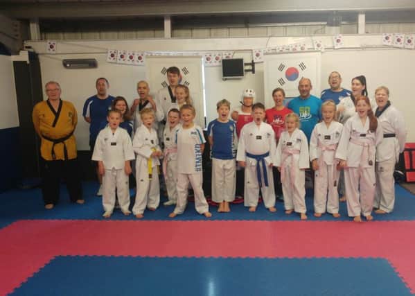 Mount Taekwondo Club have received a cash boost for Â£500 from the Montane Lakeland Ultra Tour. Runners Charles and Angela Colby, pictured with the club members, chose them as the beneficiary.
