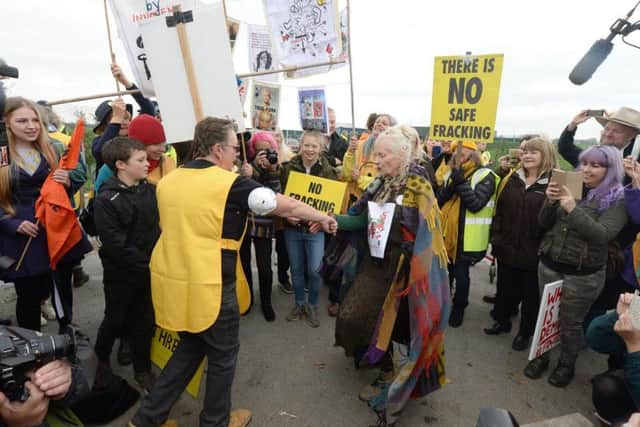 Dame VivienneWestwood dancing in the road outside the fracking site in Lancashire