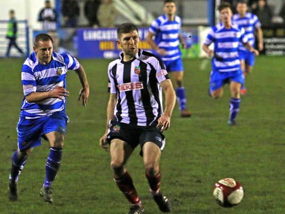 Adam Freeland in action for Lancaster City