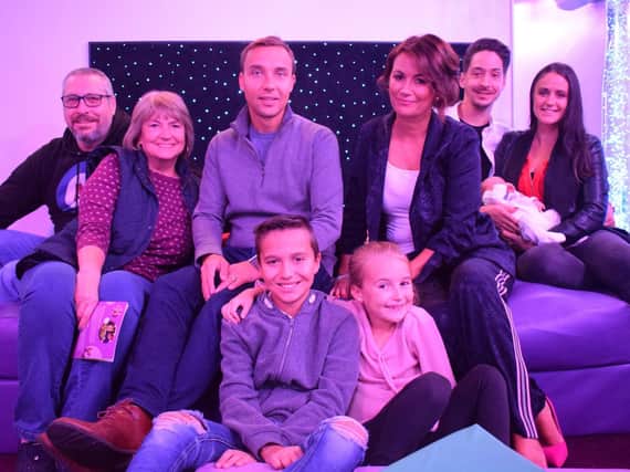 Michelle and Darren Bond with Harry, 12, and Maisey, seven, Michelles mum and dad, Susan and Ian Johnstone, her brother Mark and his fiance Becky Johnston and baby Isla at Brian House