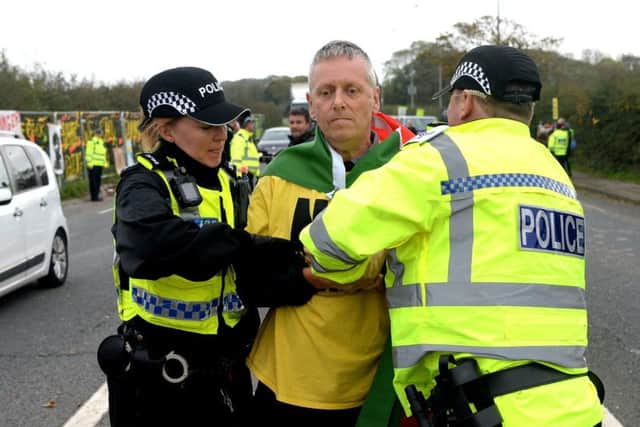 Anti-Fracking protestor in front of Cuadrilla's fracking site on Preston New Road, Blackpool. 16th October 2018.