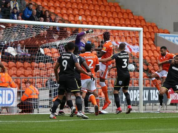 Curtis Tilt bundles home at the back post to open the scoring for Blackpool