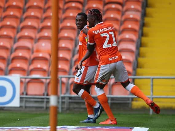 Marc Bola celebrates scoring his first goal for the club