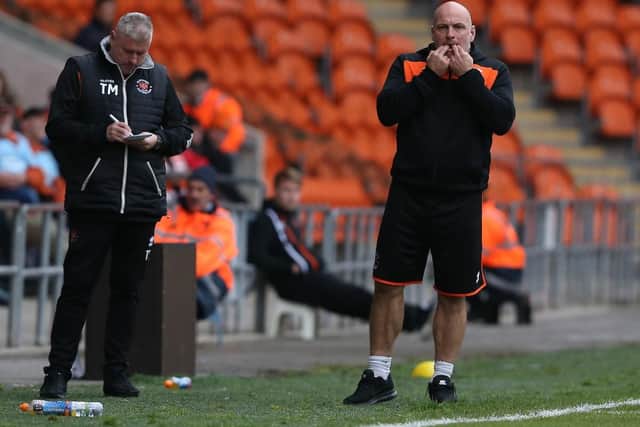 Terry McPhillips and assistant Gary Brabin on the touchline