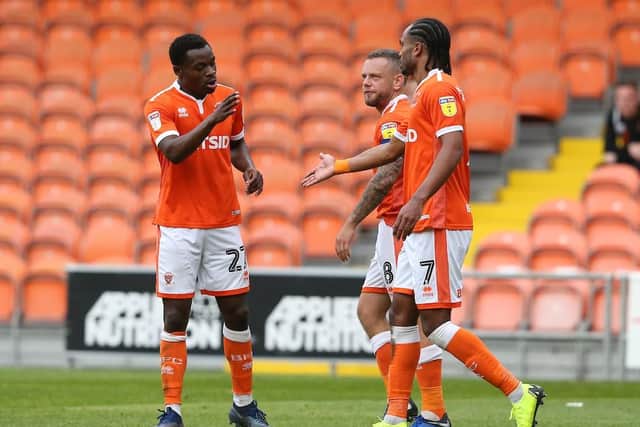 Marc Bola celebrates after netting his first goal for the club