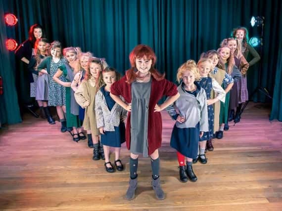 Annie Dawson fronts the cast of orphans in Thornton Cleveleys Operatic Society's production of Annie