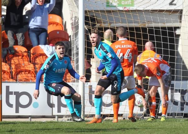 Wes Burns celebrates after scoring for Fleetwood at Bloomfield Road