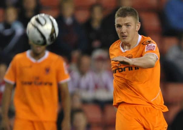 Ash Eastham in action for Blackpool at Stoke City
