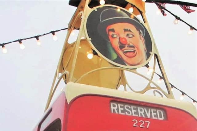 Charlie Cairoli's face can be seen on the top of the tram.