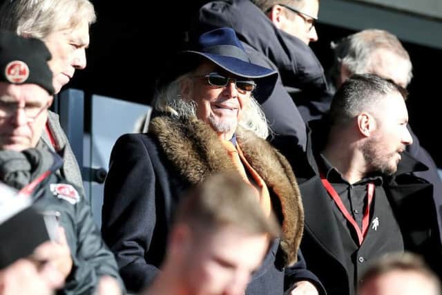 Owen Oyston watches on from the director's box