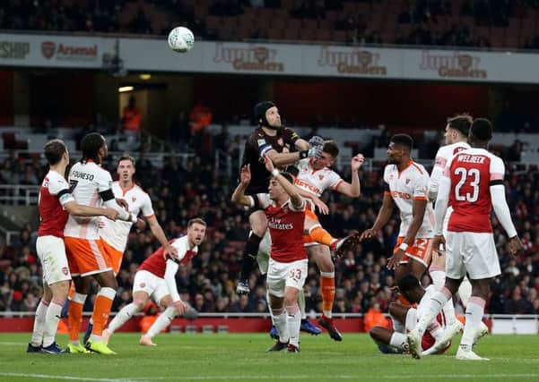 Arsenal goalkeeper Petr Cech is beaten to a cross into the penalty area at the Emirates Stadium on Wednesday night