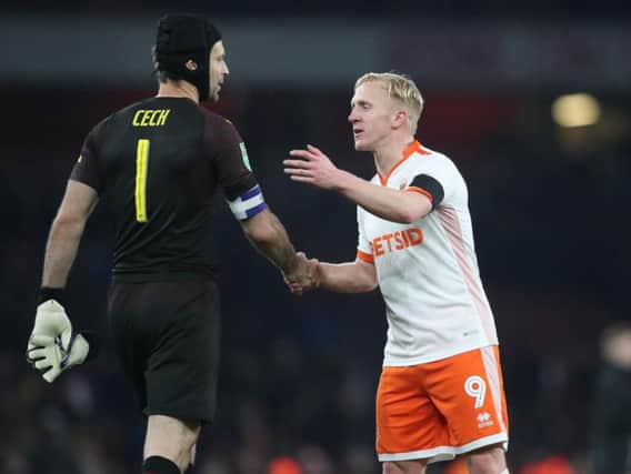 Blackpool striker Mark Cullen shakes hands with Arsenal keeper Petr Cech at the final whistle
