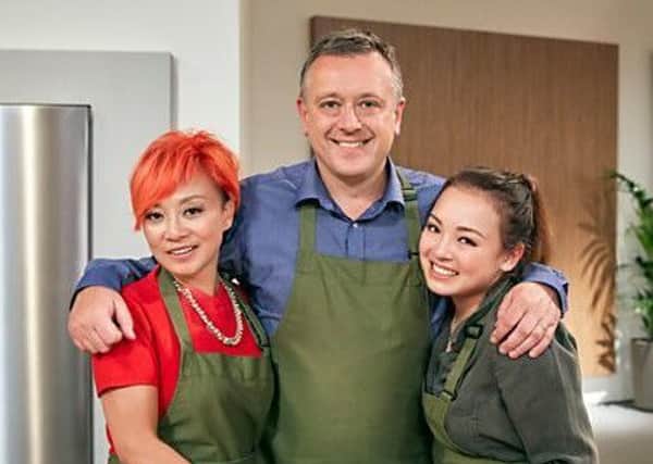 Andrew Whitaker with wife Qidi and daughter Jasmyn on the BBC TV programme Family Cooking Showdown