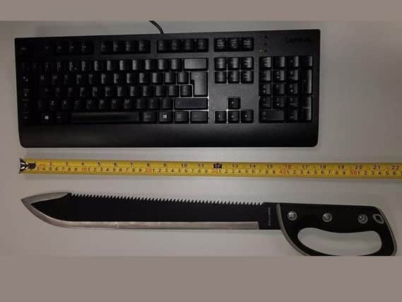 The machete was put in size comparison next to a keyboard.