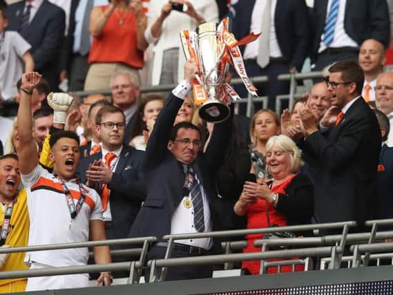 Gary Bowyer lifting the League Two play-off final trophy at Wembley in May 2017