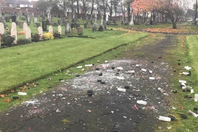 Ornamental glass candles, placed on Polish war graves in Layton cemetery, have been wrecked by vandals