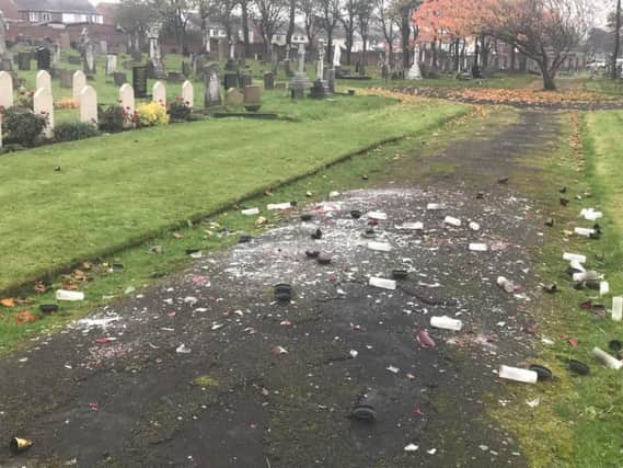 Ornamental glass candles, placed on Polish war graves in Layton cemetery, have been wrecked by vandals