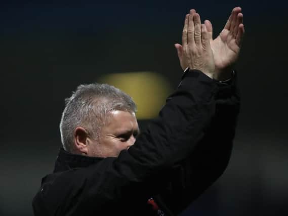Terry McPhillips applauds the Blackpool fans that made the long trip to Gillingham last night