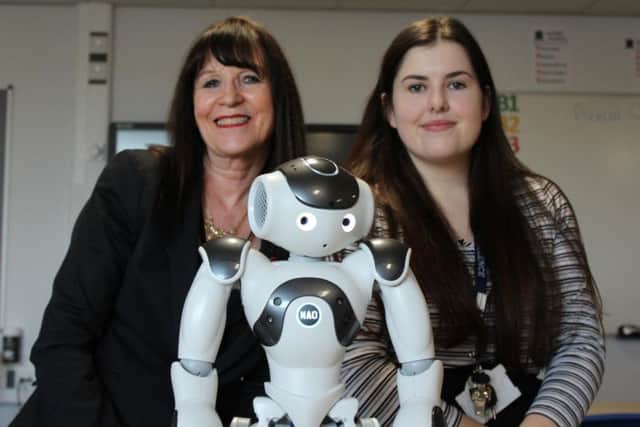 Asst headteacher Janette Webster and Computer Science teacher Rebecca Franks with NAO, Armfield Academy's robot