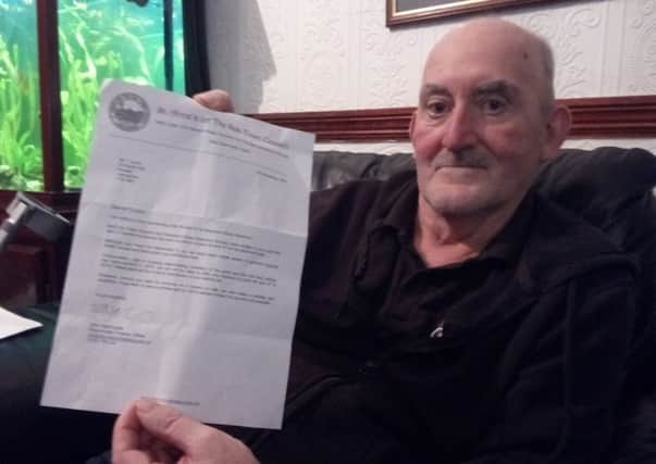Tommy Lyons with the letter received from the St Annes Town Council