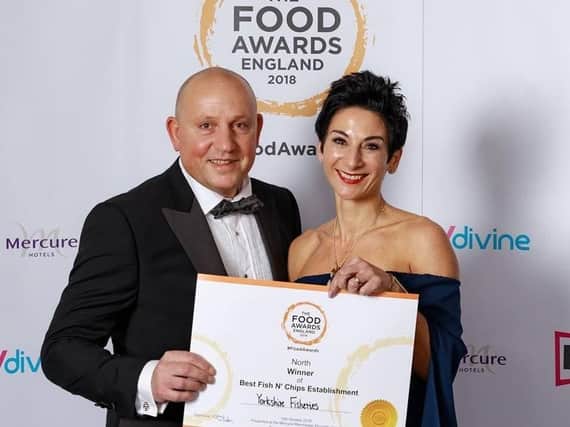Pavlos and Maria Menelaou, owners of Yorkshire Fisheries fish and chip in Blackpool, collect their award