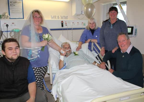 Kaz Jackson and Neil Worthington with loved ones on their wedding day, at Blackpool Victoria Hospital.