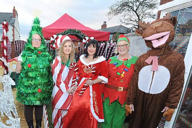 Children from Brian House visit Santa's Grotto at Jellytots.  L-R are Sharon Mancini, Claire Gaskell, Julie Eustace, Lynda Hindle and Miguel Gomez.