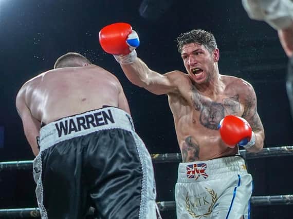 Brian Rose goes on the attack during his win over Alistair Warren. Picture: Chris Roberts for MTK Global